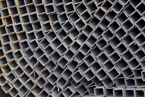 Metal profile pipe of rectangular cross section in packs at the warehouse of Stock-Fotos