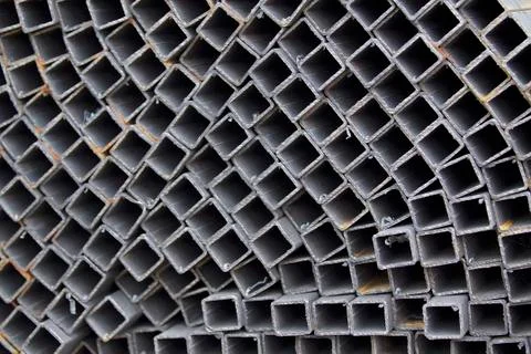 Metal profile pipe of rectangular cross section in packs at the warehouse of Stock-Fotos