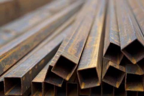 Metal profile pipe of rectangular cross section in packs at the warehouse of Photos