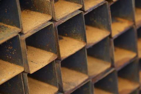 Metal profile pipe of rectangular cross section in packs at the warehouse of 库存照片