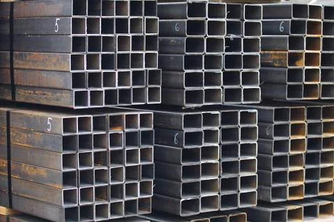 Metal profile pipe of rectangular cross section in packs at the warehouse of 写真素材