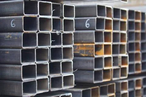 Metal profile pipe of rectangular cross section in packs at the warehouse of Stock-Fotos