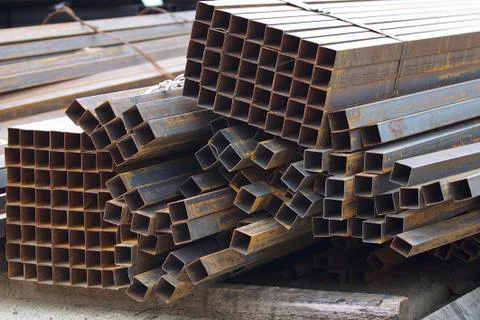 Metal profile pipe of rectangular cross section in packs at the warehouse of 스톡 사진