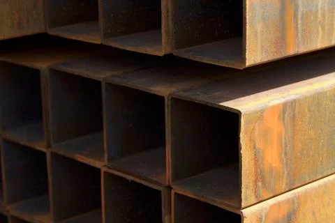 Metal profile pipe of rectangular cross section in packs at the warehouse of 库存照片