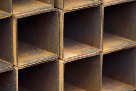 Metal profile pipe of rectangular cross section in packs at the warehouse of 스톡 사진