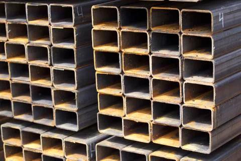 Metal profile pipe of rectangular cross section in packs at the warehouse of Stock Photos