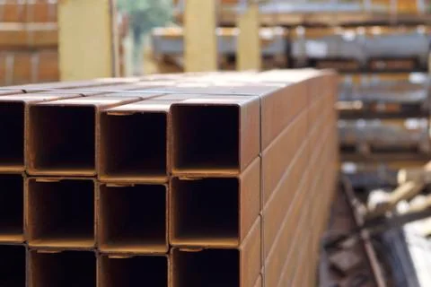 Metal profile pipe of rectangular cross section in packs at the warehouse of Stock-Fotos