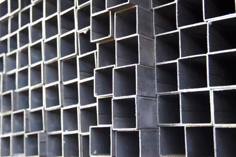 Metal profile pipe of rectangular cross section in packs at the warehouse of Stock-Fotos