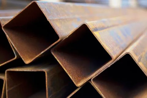 Metal profile pipe of rectangular cross section in packs at the warehouse of Фото