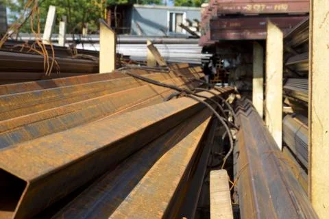 Metal profile pipe of rectangular cross section in packs at the warehouse of Foto stock