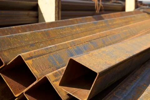 Metal profile pipe of rectangular cross section in packs at the warehouse of 写真素材