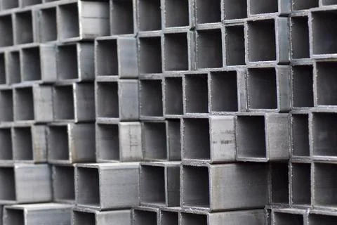 Metal profile pipe of rectangular cross section in packs at the warehouse of 스톡 사진