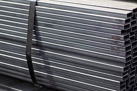Metal profile pipe of rectangular cross section in packs at the warehouse of Stock-Fotos