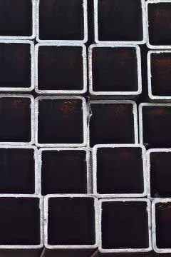 Metal profile pipe of rectangular cross section in packs at the warehouse of Stock-Fotos