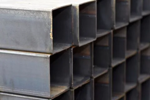 Metal profile pipe of rectangular cross section in packs at the warehouse of Фото