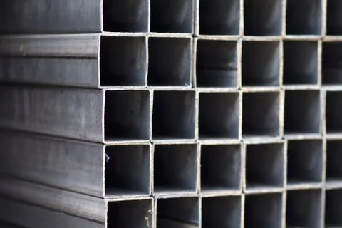 Metal profile pipe of rectangular cross section in packs at the warehouse of Stock-Fotos