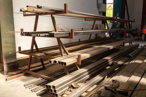 Metal profile pipe of rectangular cross section in packs at the warehouse o.. Stock Photos