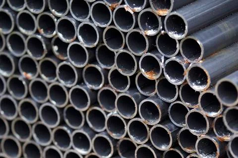 Metal profile pipe of round section in packs at the warehouse of metal produc Stock-Fotos