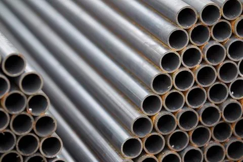 Metal profile pipe of round section in packs at the warehouse of metal produc Stock-Fotos