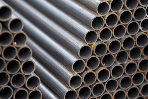 Metal profile pipe of round section in packs at the warehouse of metal produc Stock-Fotos
