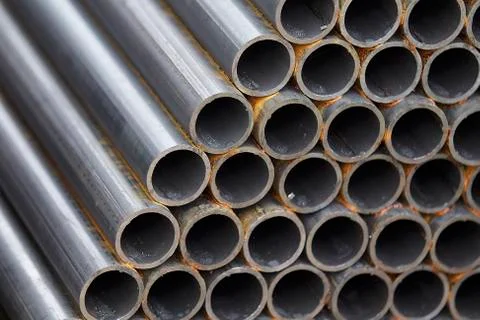 Metal profile pipe of round section in packs at the warehouse of metal produc Stock-Fotos