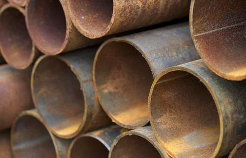 Metal profile pipe of round section in packs at the warehouse of metal produc Foto stock