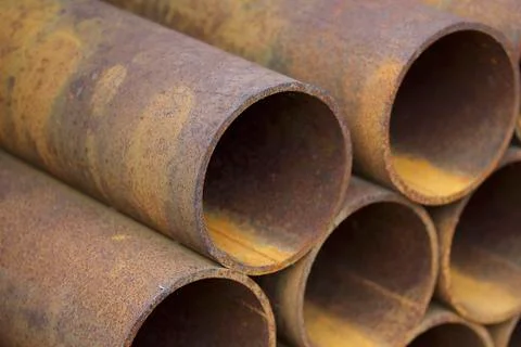 Metal profile pipe of round section in packs at the warehouse of metal produc Stock-Fotos