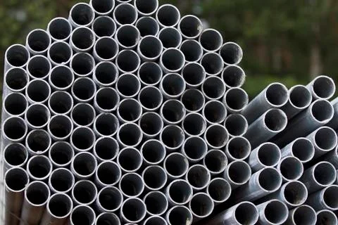 Metal profile pipe of round section in packs at the warehouse of metal produc Stock-Fotos