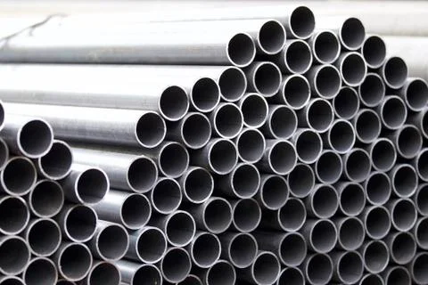 Metal profile pipe of round section in packs at the warehouse of metal produc Stock-Fotos