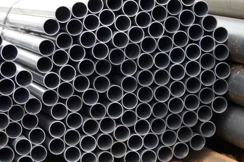 Metal profile pipe of round section in packs at the warehouse of metal produc Stock-Fotos