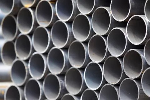 Metal profile pipe of round section in packs at the warehouse of metal produc Stock-Fotos