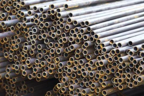 Metal profile pipe of round section in packs at the warehouse of metal produc Foto stock