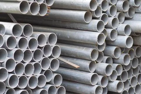 Metal profile pipe of round section in packs at the warehouse of metal produc Stock-Fotos