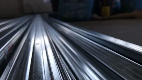 Metal profiles. Stack of stainless steel pipes in warehouse. Rolled metal Stock Footage 172326855