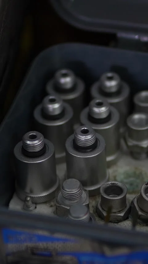 Metal quick disconnect couplings and adapters stored in a box. Stock Footage 343890891