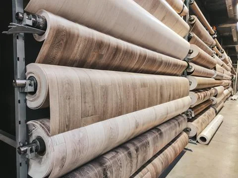 Metal rack with samples of assortment of floor coverings linoleum. Shelving i Stock Photos