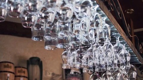 Metal rack with small clean glasses for alcohol in rows Video stock 101915404