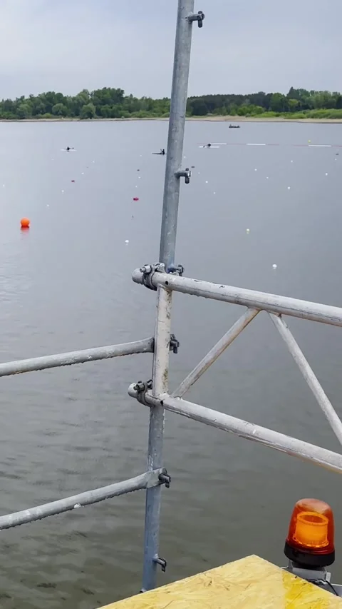 Metal Railing and Warning Beacon Overlooking Canoe Sprint Water Vídeos de archivo 345181606