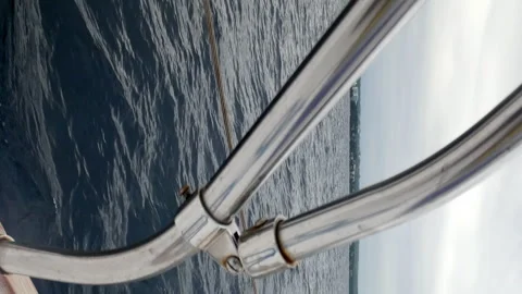 A metal railing is seen in the water Stock Footage 274031759