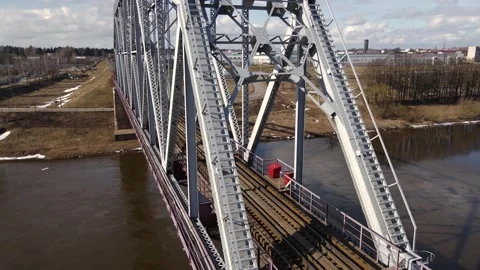 Metal railway train bridge over the river Stock Footage 150747148