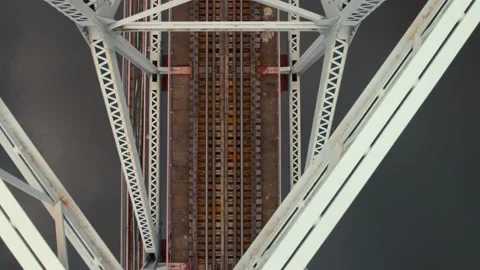 Metal railway train bridge over the river in autumn Aerial footage Stock Footage 163094956