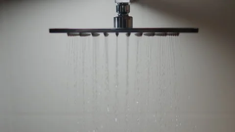 Metal rain shower. close-up rain shower watering can water jet fly. Shower h Stock Footage 242529763