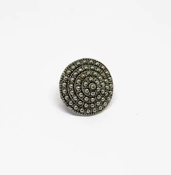 Metal Ring with Circular Dot Pattern on White Surface Jewelry Round Decorativ Stock Photos