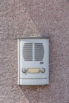 Metal ring intercom with two buttons or dials for doоrbell and speaker Stock Photos