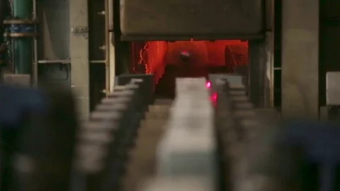 Metal rods move in a rolling mill, square bar steel. Stock Footage 72713650