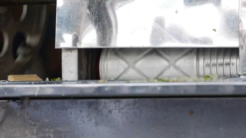 Metal roller in a sugarcane juice machine presses cane in a close up industrial 스톡 동영상 341408672