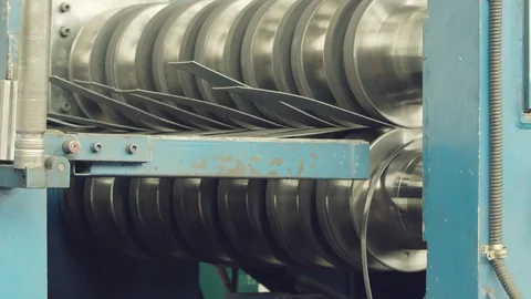 Metal rolls of roll forming machine at a metalwork manufacturing, Stock Footage 121191031