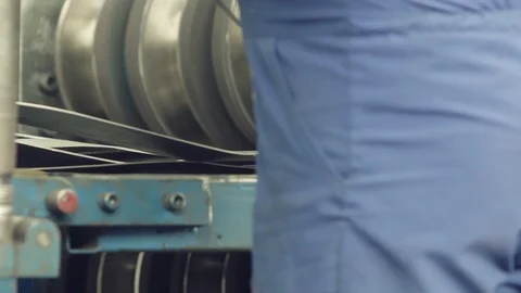 Metal rolls of roll forming machine at a metalwork manufacturing, Stock Footage 121191081