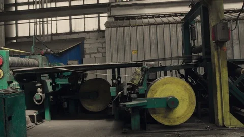 Metal rolls of roll forming machine at a metalwork manufacturing, Stock Footage 121191231