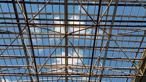 Metal roof frame structure of abandoned building against sunny sky Stock Footage 346230946